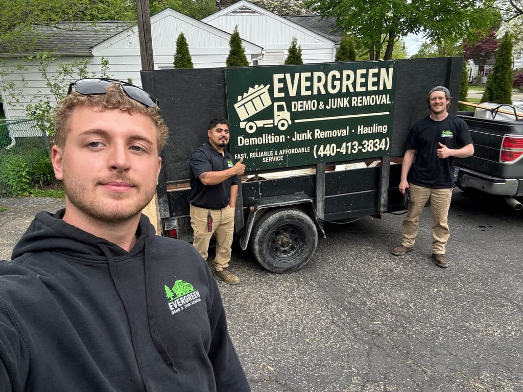 Evergreen team with branded trailer ready for a job