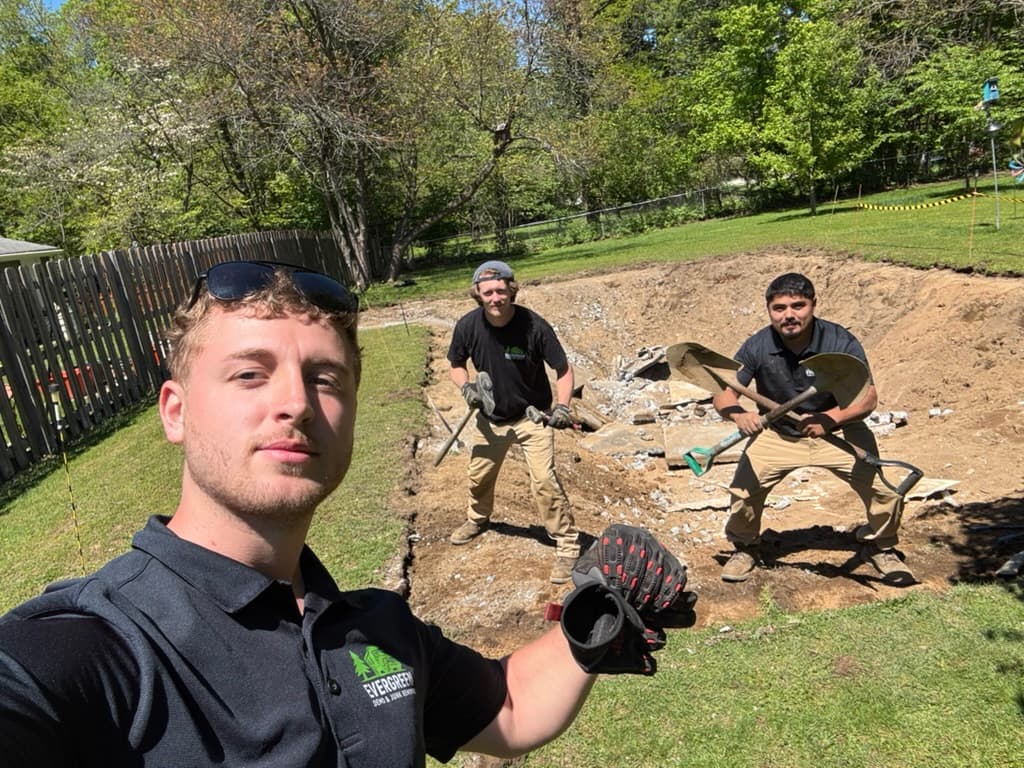 Crew excavating and clearing a property foundation